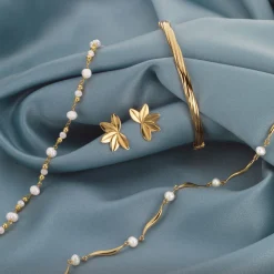 SCROUPLES BLAD ØRESTIKKER I FORGYLDT SØLV - 165942